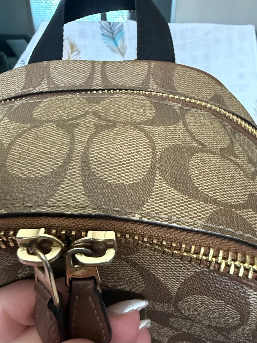 Coach Brown Signature Leather Backpack with gold hardware